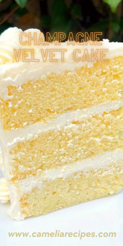 Champagne Velvet Cake with pink champagne frosting, sliced and topped with edible pearls, on a white cake stand.