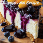 An overhead photo of a no-bake peach blueberry cheesecake topped with vibrant slices of fresh peaches and juicy blueberries, sitting on a rustic wooden table.